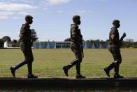 Soldiers patrol outside the president's official residence, Alvorada Palace, in Brasilia, Brazil, Tuesday, July 7, 2020. Brazil's President Jair Bolsonaro said Tuesday he tested positive for COVID-19. (AP Photo/Eraldo Peres)