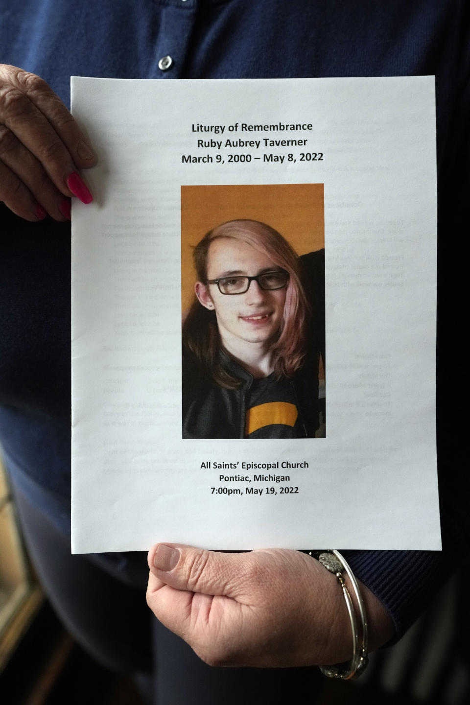 Karen Kobylik holds a funeral program for her daughter Ruby Taverner, Monday, May 1, 2023, in Pontiac, Mich. Ruby shot and killed her boyfriend Ray Muscat and brother Bishop Taverner before taking her own life hours later on May 8, 2022. Kobylik had spent the weeks prior calling police asking them to remove her daughter's firearm. "They said we can't take any guns away from her because we cannot step on her second amendment right," Kobylik told The Associated Press. Michigan is poised to become the 20th state in the nation to pass red flag laws. (AP Photo/Carlos Osorio)