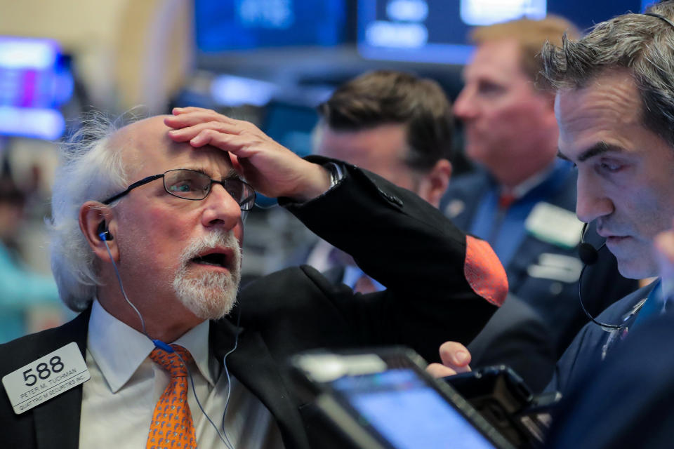 Traders work on the floor at the New York Stock Exchange (NYSE) in New York City, U.S., November 12, 2018. REUTERS/Brendan McDermid