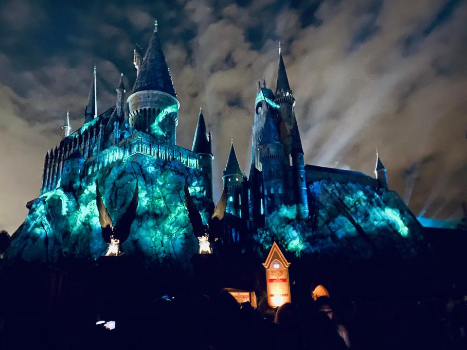 exterior spot of hogwarts castle at universal orlando lit up at night