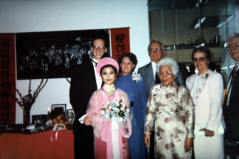 The real Madame Ty Vu, in traditional Vietnamese "ao dai," next to the real Grandma Mary Simons, right, at the wedding of grandchildren Thuan and Bob Elston in 1995 in Southern California.