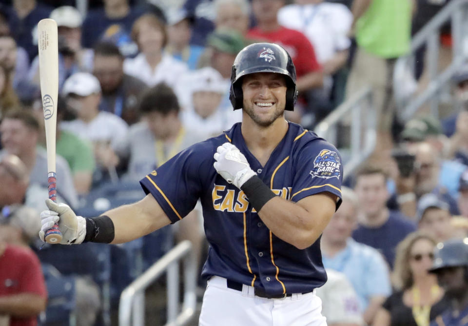 FILE - In this July 11, 2018, file photo, Eastern Division's Tim Tebow walks up to the plate during the second inning of the Eastern League All-Star minor league baseball game in Trenton, N.J. Before picking football over baseball, Kyler Murray got some advice from another famous two-sport star. Tim Tebow says he told Murray to follow his heart when deciding between the Oakland Athletics and pursuing an NFL career. (AP Photo/Julio Cortez, File)