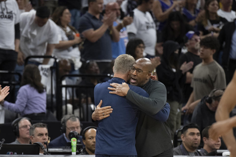 Sacramento Kings head coach Mike Brown, right, embraces Golden State Warriors head coach Steve Kerr following Game 7 of an NBA basketball first-round playoff series Sunday, April 30, 2023, in Sacramento, Calif. (AP Photo/José Luis Villegas)