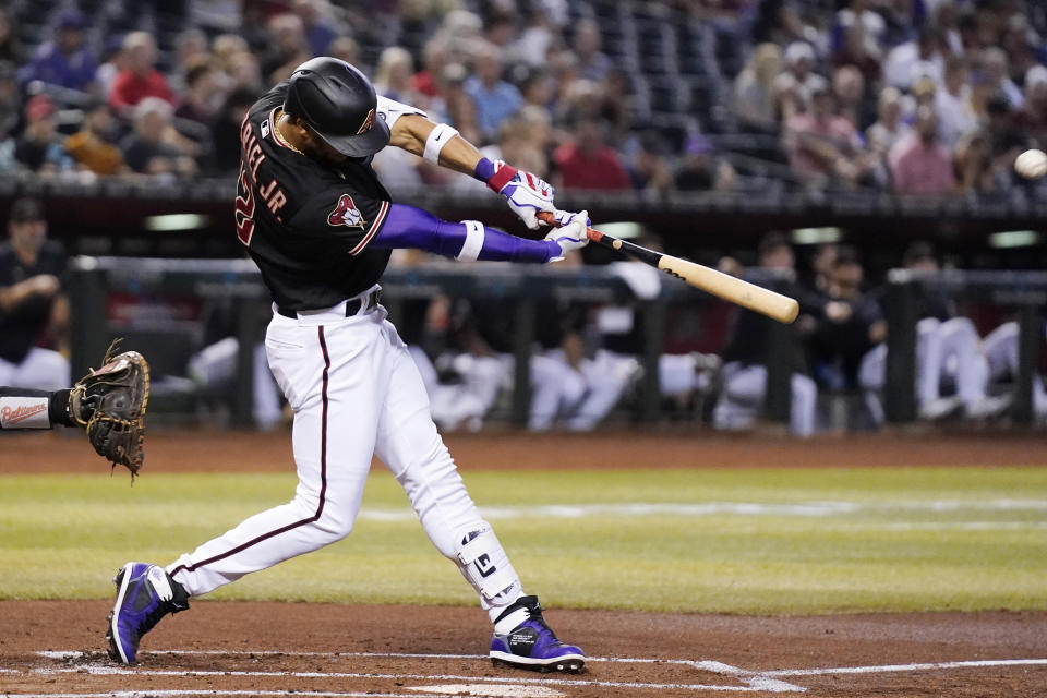 Arizona Diamondbacks' Lourdes Gurriel Jr. connects for a two-run home run against the Baltimore Orioles during the first inning of a baseball game Friday, Sept. 1, 2023, in Phoenix. (AP Photo/Ross D. Franklin)