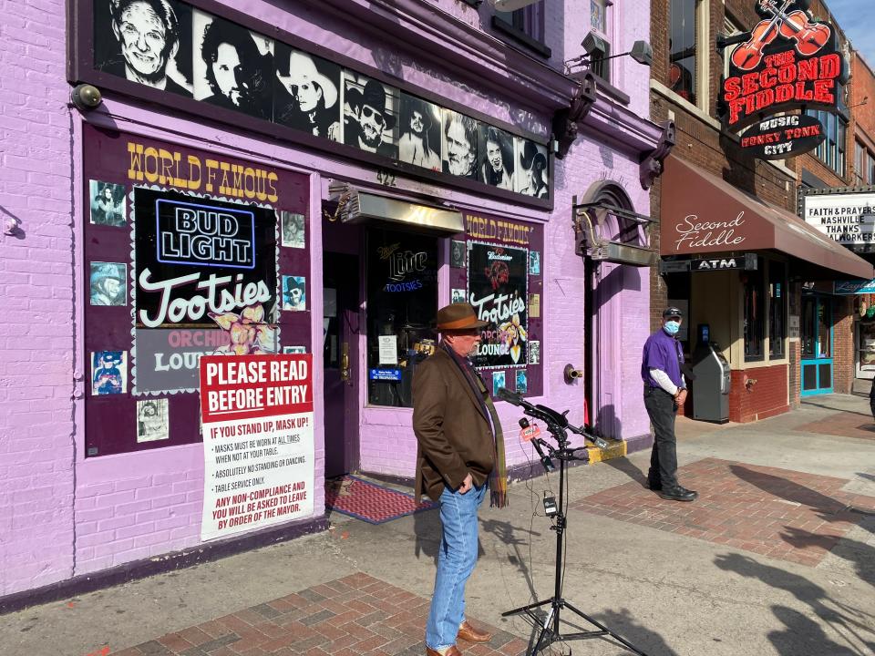 Downtown honky-tonk owner Steve Smith speaks to reporters outside Tootsies Orchid Lounge on Tuesday afternoon.