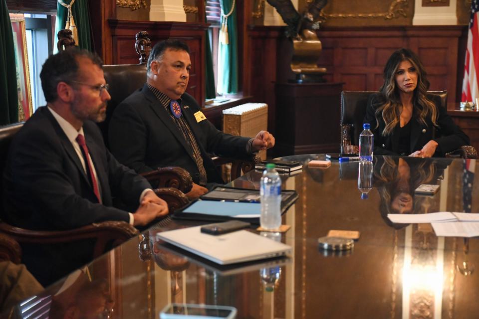 (Left to right) South Dakota Department of Social Services Matt Althoff, Department of Tribal Relations Secretary David Flute and Gov. Kristi Noem speak with the Argus Leader and South Dakota Searchlight in her office at the South Dakota Capitol in Pierre on Tuesday, Sept. 26, 2023. (Samantha Laurey, Argus Leader)