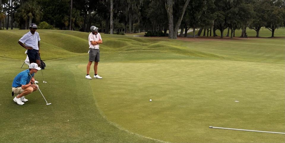 Hamilton Coleman of Augusta, Ga., looks over a par putt at the 18th hole of the Players Stadium Course at TPC Sawgrass on Aug. 31 during the second round of the Junior Players Championship. He made the putt for a 68.