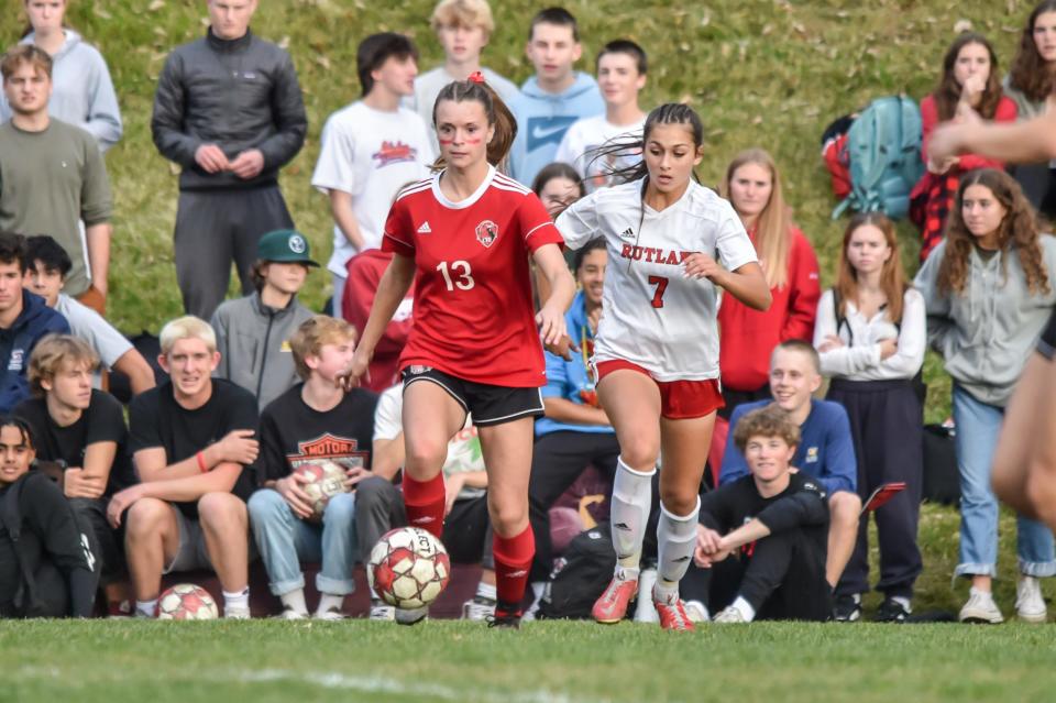 CVU's Ava Barron gets out ahead of Rutland's Bethany Solari during the Redhawks' 3-0 semifinal win over Rutland in 2022.