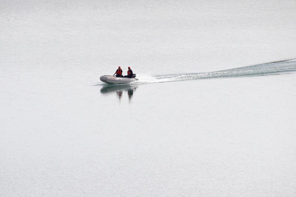 A police dingy navigates in the Arade dam near Silves (AP)