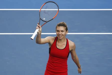 Tennis - Australian Open - Margaret Court Arena, Melbourne, Australia, January 22, 2018. Simona Halep of Romania celebrates winning against Naomi Osaka of Japan. REUTERS/Thomas Peter