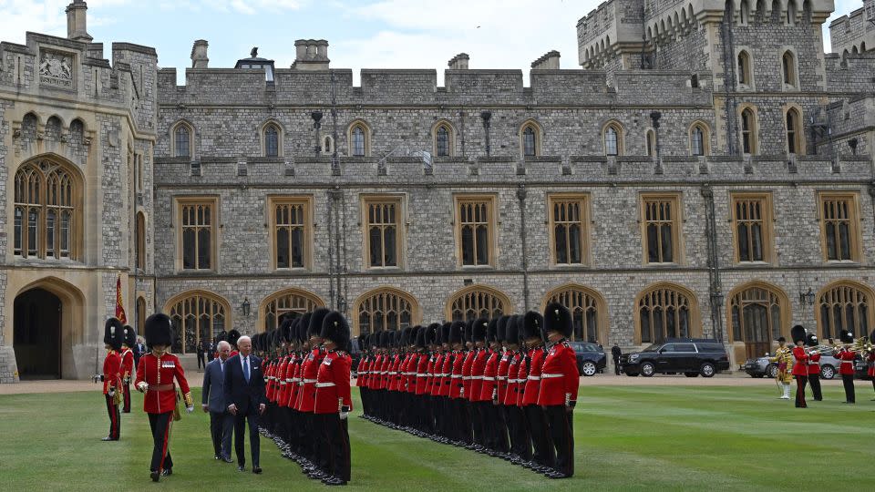 The pair inspect an honor guard formed by the Welsh Guards, during a ceremonial welcome in the Quadrangle at the royal residence.  - Andrew Caballero Reynolds/AFP/Getty Images