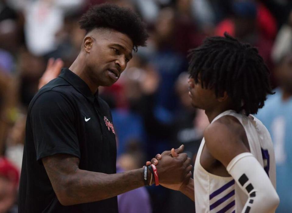 Ridge View High School assistant coach Carlos Powell (left) speaks with Tyler Rice during a timeout during River View’s 57-77 loss to Dorman High School in the Bojangles Bash held Saturday, December 14, 2019 at River View High School.