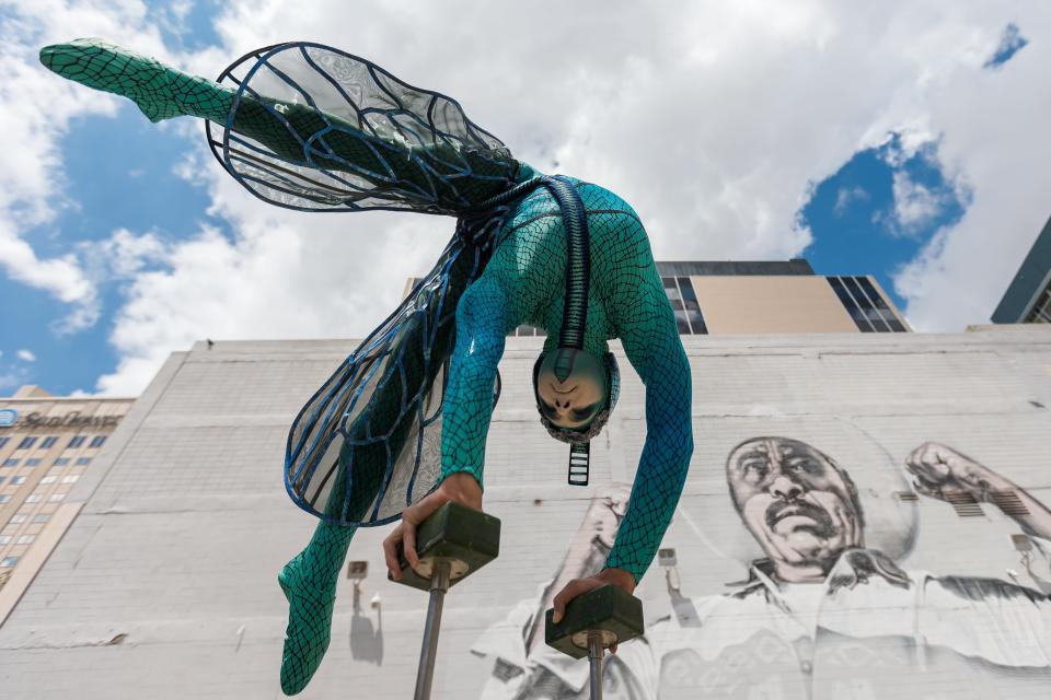 Kyle Cragle, a Cirque du Soleil performer, shows his skills in front of the "Ánimo Sin Fronteras" mural in Downtown El Paso on Tuesday, Aug. 23, 2022. At 15, Cragle left his home to pursue his dreams and attend the National Circus School’s high school program in Montreal. There, he discovered his love for handstands, and eventually entered the school's college program to study full time as a hand-balancing contortionist artist.