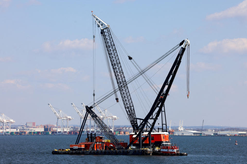 FILE PHOTO: Large cranes in the Patapsco River near the collapsed Francis Scott Key Bridge in Baltimore, Maryland, U.S., March 29, 2024. REUTERS/Julia Nikhinson/File Photo