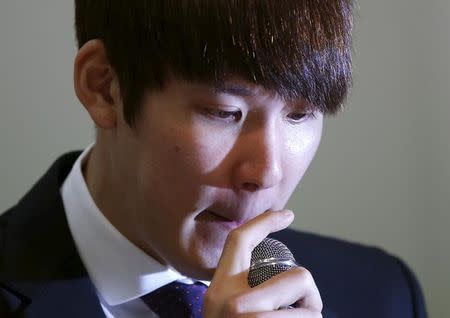 South Korea's Olympic swimming champion Park Tae-hwan reacts as he answers reporters' questions during a news conference at a hotel in Seoul March 27, 2015. REUTERS/Kim Hong-Ji