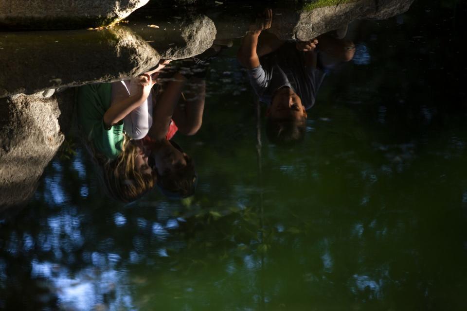 Children play on the rocks