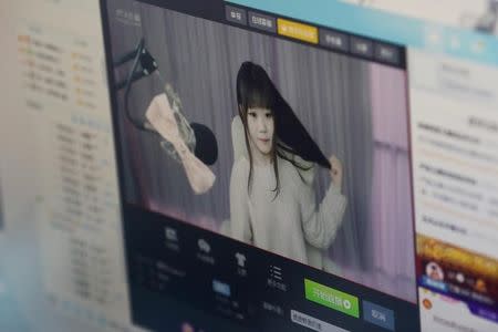 A girl broadcasts at Three Minute TV, a live streaming talent agency in Beijing, China, February 15, 2017. Picture taken February 15, 2017. REUTERS/Thomas Peter