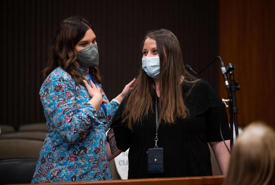 Assistant Public Defender Addie Young, left, who was assigned to represent Shanie Phillips, stands with Phillips as she graduates from Mental Health Court, a diversion program set up to ease jail and prison overcrowding, in Judge Lawrence Brown’s courtroom Tuesday, Jan. 25, 2022, in Sacramento Superior Court.