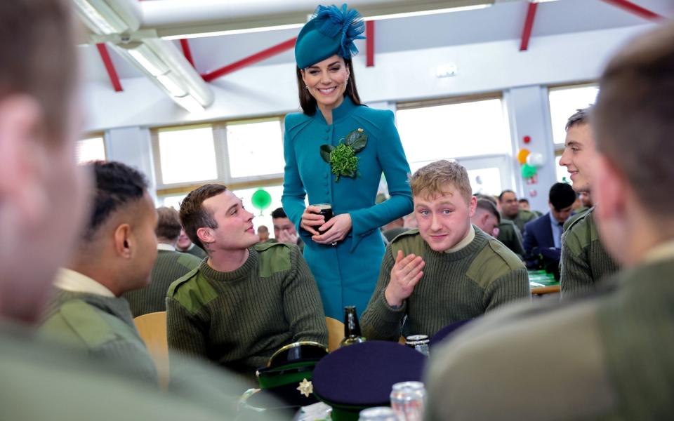 The Princess of Wales chats with members of the Irish Guards cradling a glass of Guinness - Chris Jackson/PA Wire