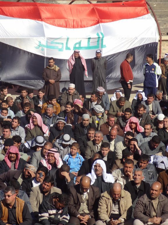 Sunni Muslims rally in Kirkuk on Friday to criticise Iraq's premier and demand the release of prisoners. The nationwide protests, which come amid a political deadlock between Prime Minister Nuri al-Maliki's Shiite-led government and a secular Sunni-backed party that is in his cabinet but publicly opposes him, have blocked off a key trade route and forced heavy security measures