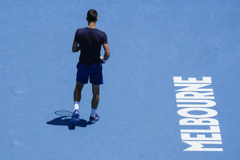 Defending men's champion Serbia's Novak Djokovic practices on Rod Laver Arena ahead of the Australian Open tennis championship in Melbourne, Australia, Wednesday, Jan. 12, 2022. AP Photo/Mark Baker)