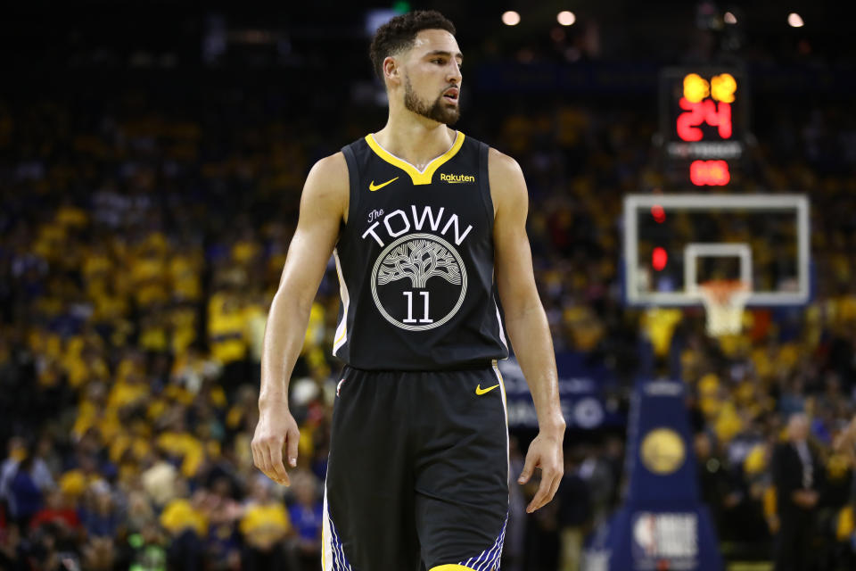 OAKLAND, CALIFORNIA - JUNE 13: Klay Thompson #11 of the Golden State Warriors reacts in the first half against the Toronto Raptors during Game Six of the 2019 NBA Finals at ORACLE Arena on June 13, 2019 in Oakland, California. NOTE TO USER: User expressly acknowledges and agrees that, by downloading and or using this photograph, User is consenting to the terms and conditions of the Getty Images License Agreement. (Photo by Ezra Shaw/Getty Images)