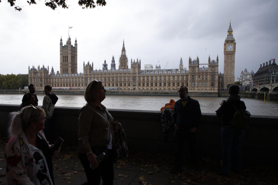 FILE - A general view of the Houses of Parliament at sunrise in London, Friday, Oct. 21, 2022. From red wall to king's speech, UK elections have a vocabulary all their own. (AP Photo/David Cliff, File)