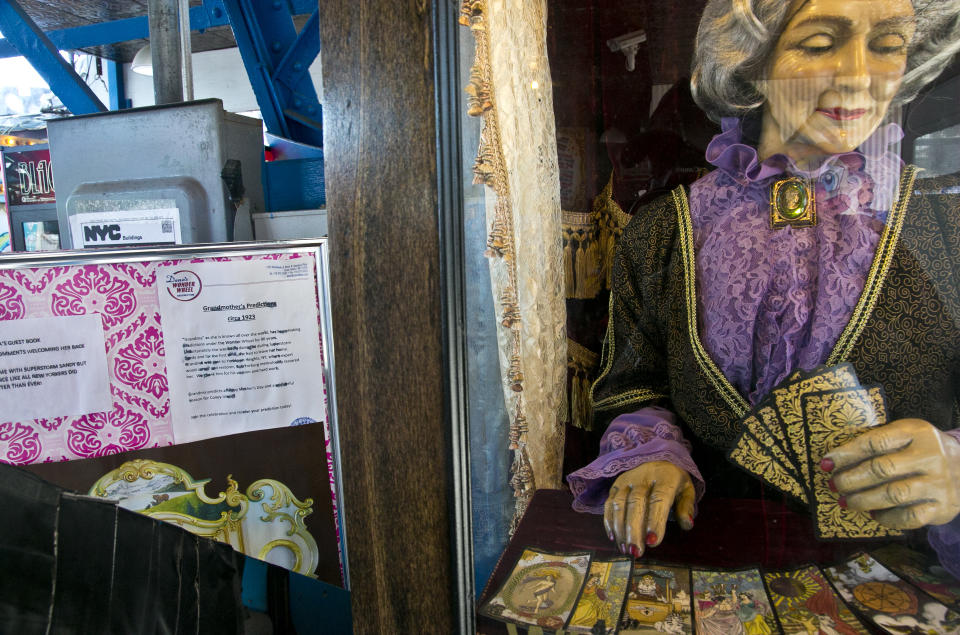 This June 12, 2013 photo shows the 90-year-old fortune telling machine "Grandma's Predictions," which was restored after damage in superstorm Sandy at the amusement park in the Coney Island neighborhood in the Brooklyn borough of New York. (AP Photo/Bebeto Matthews)