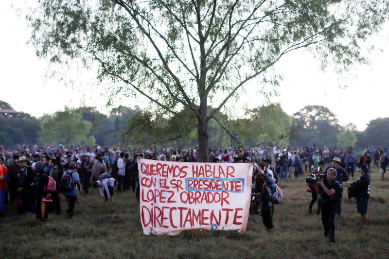 Migrants, mainly from Central America, marching in a caravan walk after crossing the Suchiate river on the outskirts of Ciudad Hidalgo