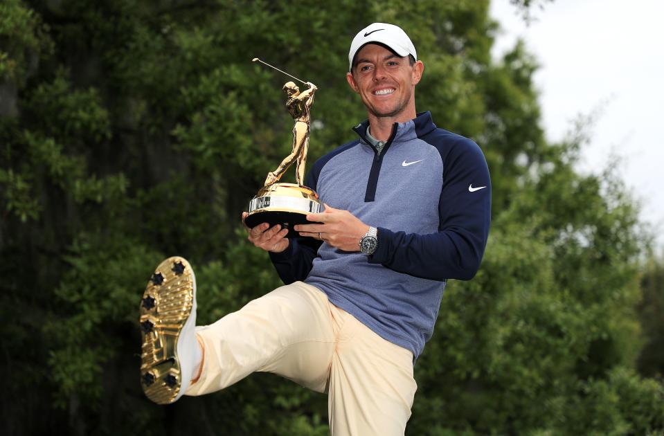 PONTE VEDRA BEACH, FLORIDA - MARCH 17:  Rory McIlroy of Northern Ireland shows how the sole of his shoes matches the winner's trophy after winning The PLAYERS Championship on The Stadium Course at TPC Sawgrass on March 17, 2019 in Ponte Vedra Beach, Florida. (Photo by Mike Ehrmann/Getty Images)