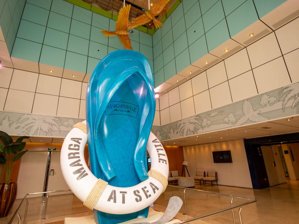 A giant statue flip flop that says "Margaville at sea"