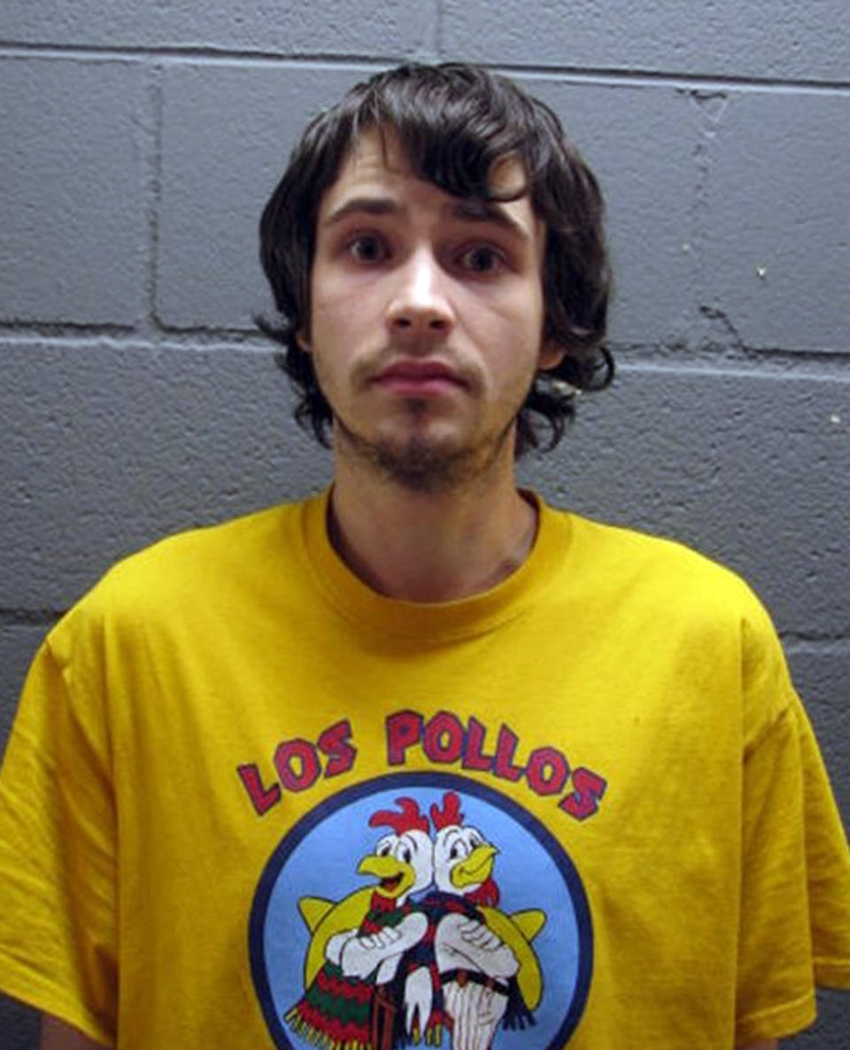 In this undated booking photo provided by the Cook County Sheriff's Office, Daniel Kowalski, a suburban Chicago man accused of operating a methamphetamine lab, wears a t-shirt for the fictional Los Pollos Hermanos chicken restaurant depicted in "Breaking Bad," a show about a methamphetamine manufacturer. Kowalski, 21, is charged with felony possession of a controlled substance, methamphetamine manufacturing materials and precursors. (AP Photo/Cook County Sheriff's Office)