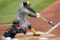 Milwaukee Brewers' Rhys Hoskins (12) hits an RBI double off of Pittsburgh Pirates starting pitcher Mitch Keller during the fifth inning of a baseball game in Pittsburgh, Thursday, April 25, 2024. (AP Photo/Gene J. Puskar)