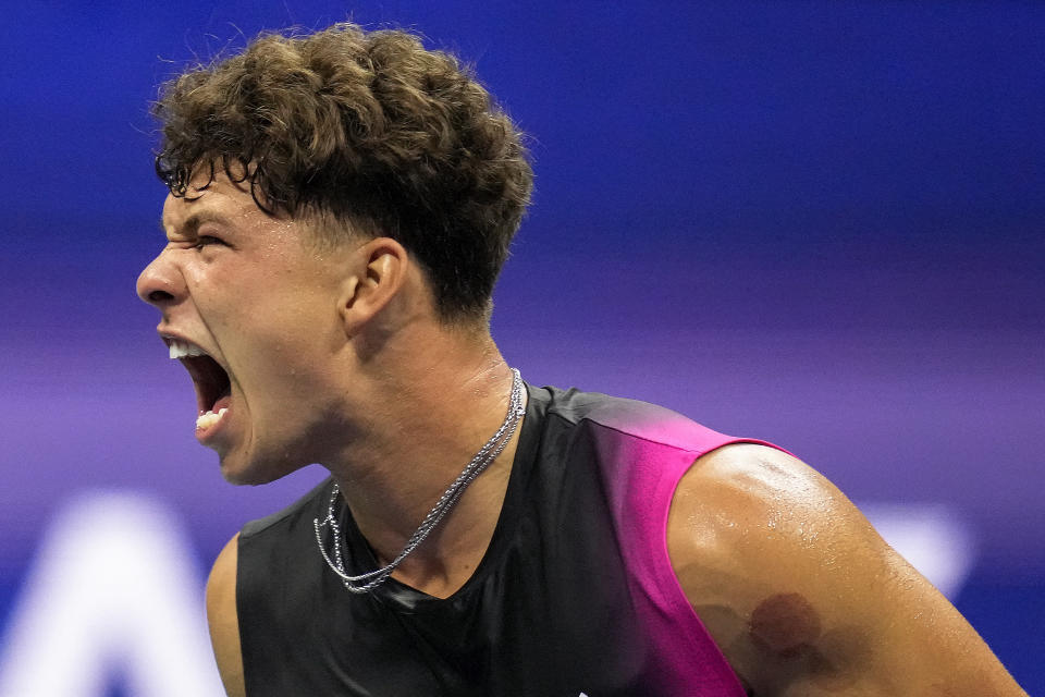 Ben Shelton, of the United States, reacts during a match against Frances Tiafoe, of the United States, during the quarterfinals of the U.S. Open tennis championships, Tuesday, Sept. 5, 2023, in New York. (AP Photo/Charles Krupa)