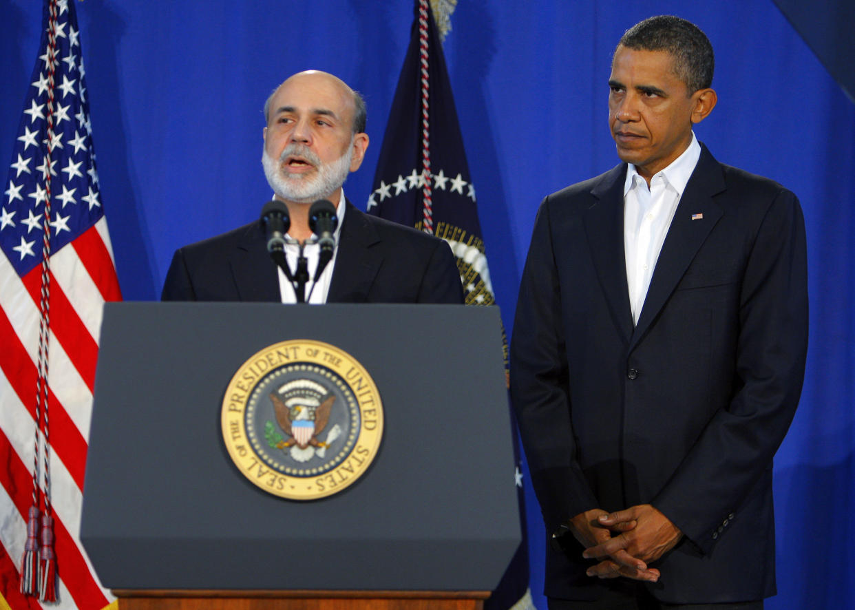 U.S. President Barack Obama (R) listens after announcing his nomination of Federal Reserve Chairman Ben Bernanke to a second term, in Oak Bluffs, Massachusetts in this August 25, 2009 file photo.  Before the financial crisis erupted in 2008, executive pay was hardly a front-burner issue at the U.S. Federal Reserve.  To match FINANCIAL/PAY-FED-POLITICS   REUTERS/Brian Snyder/Files  (UNITED STATES POLITICS BUSINESS)