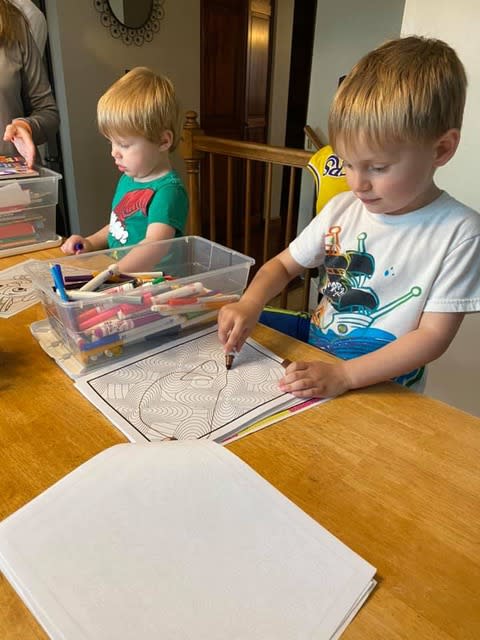 Kids work on the activities in the book. (Photo submitted)