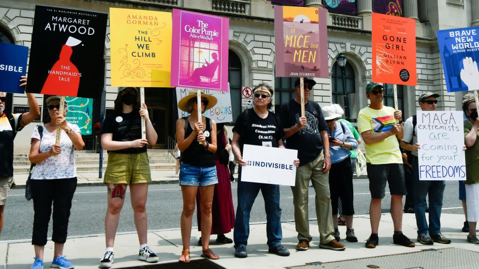 Demonstrators stand outside the Free Library of Philadelphia as the Moms for Liberty group holds a summit at a hotel in the city in June 2023. - Bastiaan Slabbers/Reuters