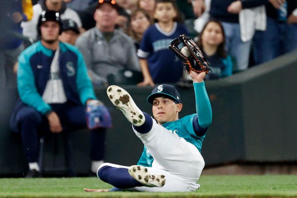 SEATTLE, WASHINGTON - SEPTEMBER 30: Sam Haggerty #0 of the Seattle Mariners makes a catch for an out during the fourth inning against the Oakland Athletics at T-Mobile Park on September 30, 2022 in Seattle, Washington. (Photo by Steph Chambers/Getty Images)