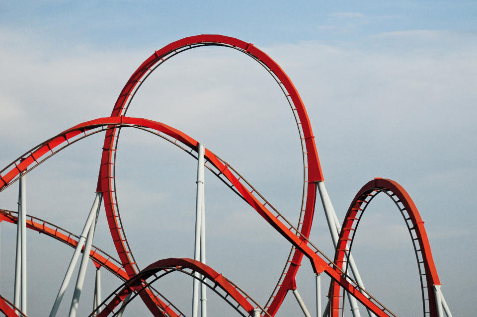 red rollercoaster in an amusement park