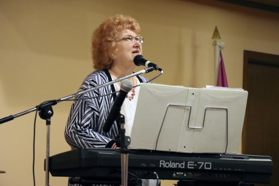 Lana Meyerholtz, a pastor with Miracle Covenant Church House of Prayer Healing Center, provides music for the National Day of Prayer service hosted by the church Thursday afternoon.