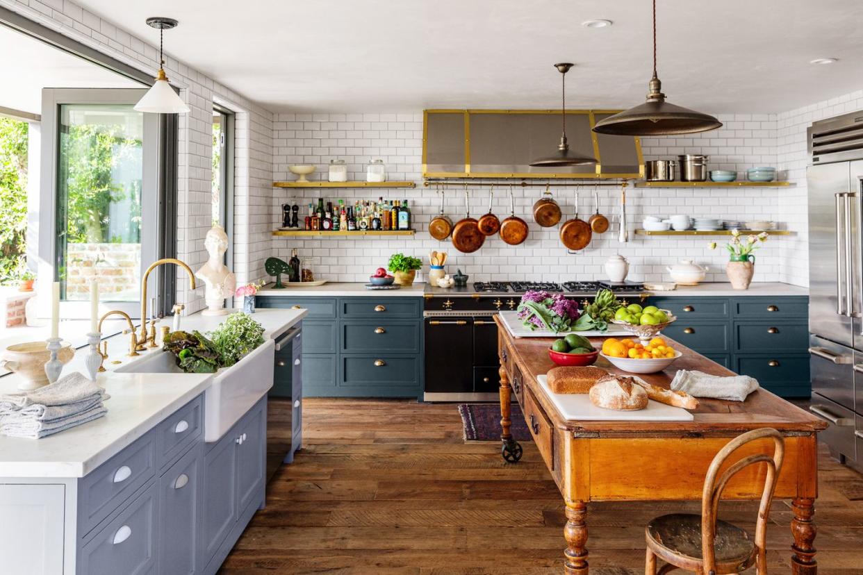 a modern cottage kitchen with blue cabinets