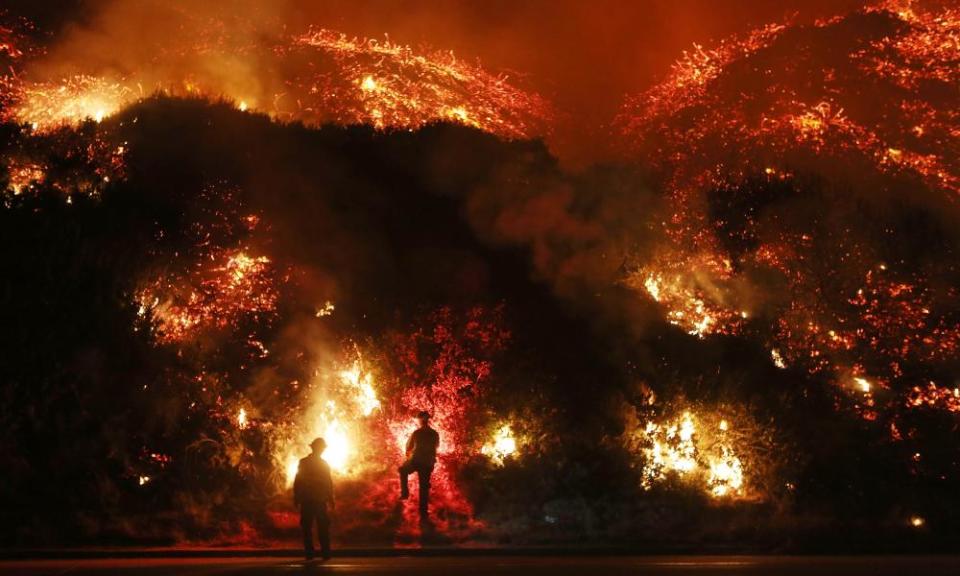 Welcome to Christmas in California. Firefighters monitor a section of the Thomas Fire along the 101 freeway on December 7, 2017 north of Ventura, California. Strong Santa Ana winds are rapidly pushing multiple wildfires across the region, expanding across tens of thousands of acres and destroying hundreds of homes and structures.