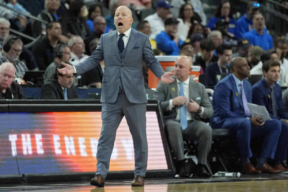 UCLA head coach Mick Cronin motions towards the court during the second half of an NCAA college basketball game against Oregon State in the first round of the Pac-12 tournament Wednesday, March 13, 2024, in Las Vegas. (AP Photo/John Locher)