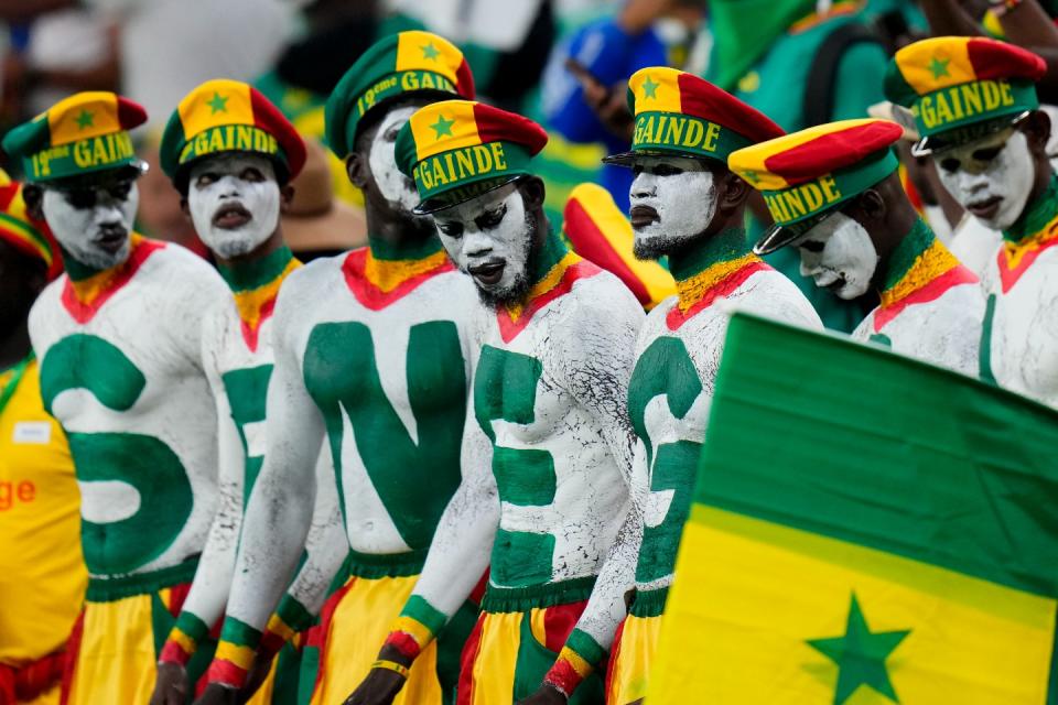 Senegal's fans wait for the start of the World Cup, group A football match between Senegal and Netherlands at the Al Thumama Stadium in Doha, Qatar, Monday, Nov. 21, 2022. (AP Photo/Petr David Josek)