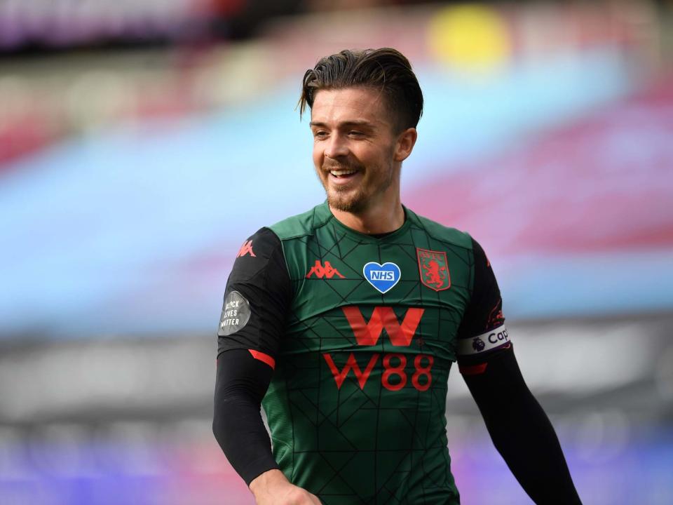 Jack Grealish was all smiles after helping Villa stay up: EPA
