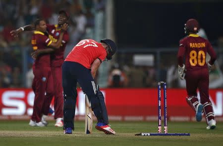 Cricket - England v West Indies - World Twenty20 cricket tournament final - Kolkata, India - 03/04/2016. England's Jason Roy (2nd R) reacts as West Indies players celebrate his dismissal. REUTERS/Adnan Abidi