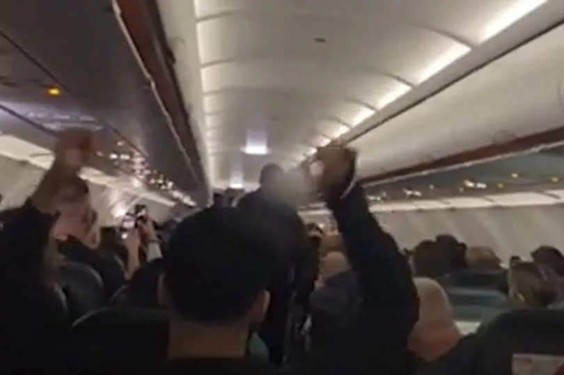 Passengers sang 'cheerio, cheerio' as they were removed by police