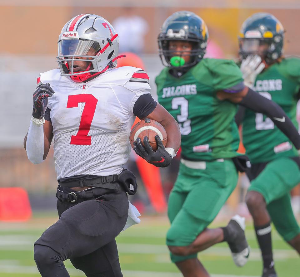 East running back Ziaire Stevens races past two Firestone defenders on his way to a 70-yard TD run on the first play of the game, Saturday, Sept. 30, 2023.