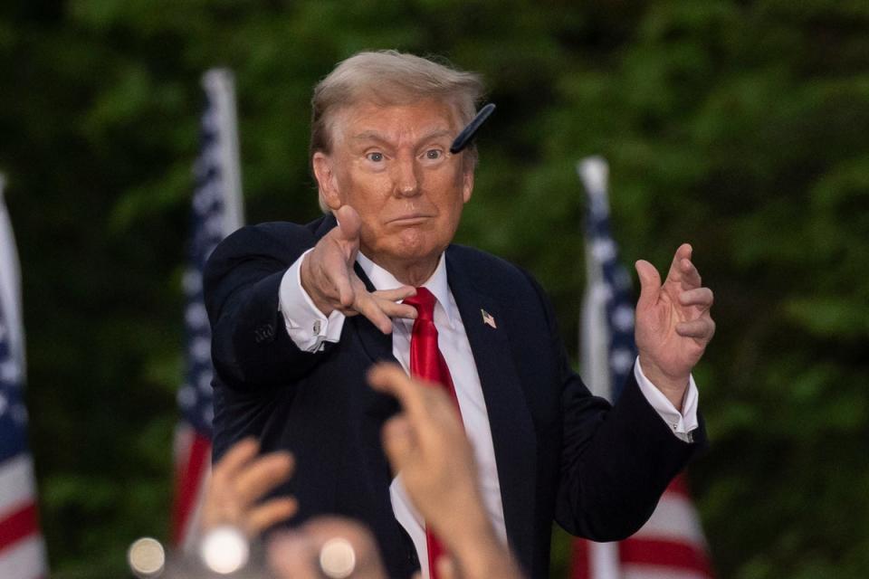 Former President Donald Trump throws a pen during a campaign rally in the south Bronx on May 23 (AP)