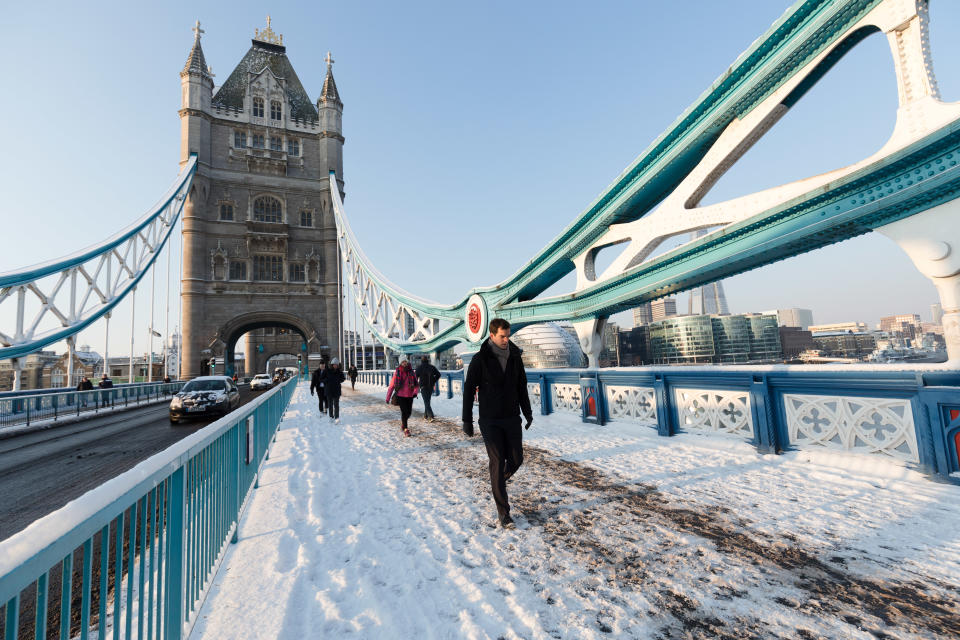 People walk across a snow covered Tower Bridge in London, England on February 28th, 2018. Freezing weather conditions dubbed the 'Beast from the East' have brought snow and sub-zero temperatures to the UK.  (photo by Vickie Flores/In Pictures via Getty Images Images)